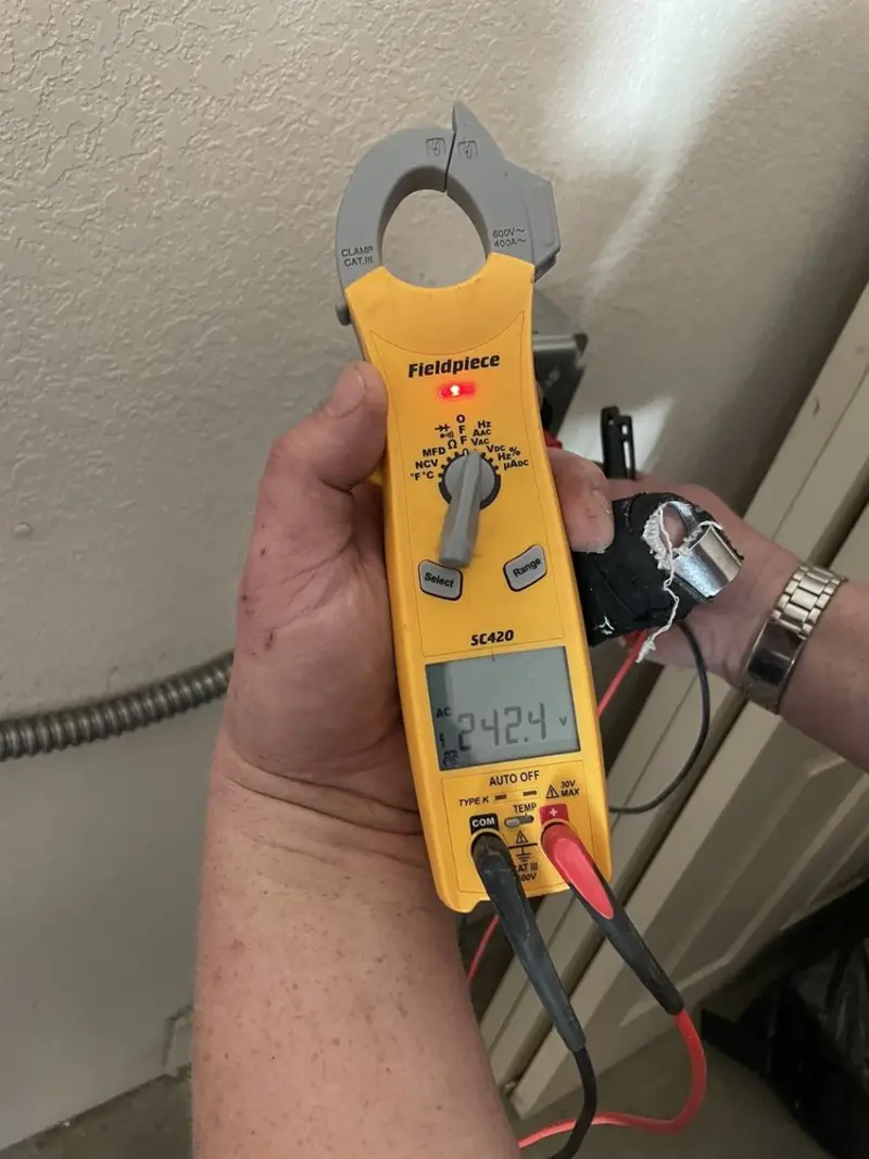 Voltage testing with clamp meter during Recessed Lighting Installation in Tiptonville